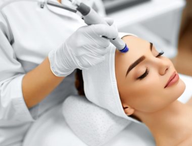 Face Skin Care. Close-up Of Woman Getting Facial Hydro Microdermabrasion Peeling Treatment At Cosmetic Beauty Spa Clinic. Hydra Vacuum Cleaner. Exfoliation, Rejuvenation And Hydratation. Cosmetology.